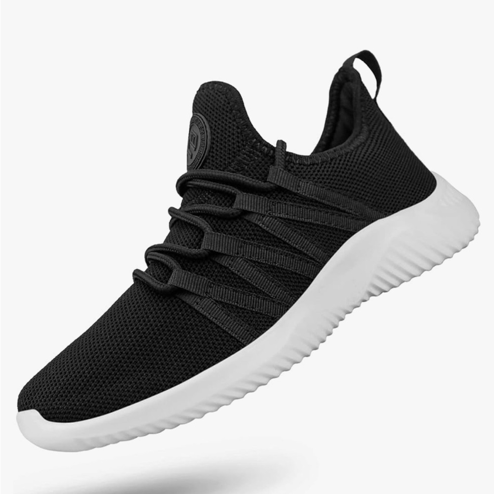 Black and white slip on running shoes.